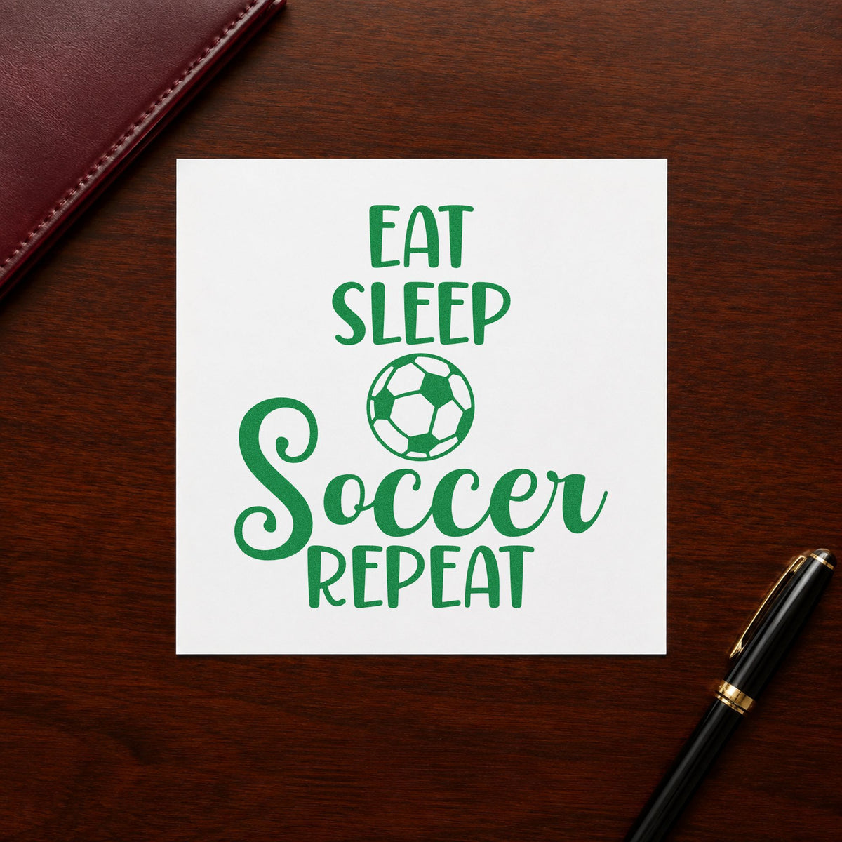 Eat Sleep Soccer Repeat craft stamp imprint in green ink on a handmade project, one idea being framed bunk art.