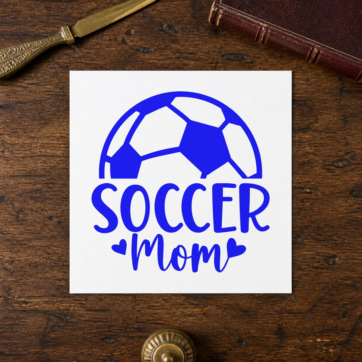 Soccer Mom Ball craft stamp in blue ink on cardstock, an easy option for stadium blanket corners.