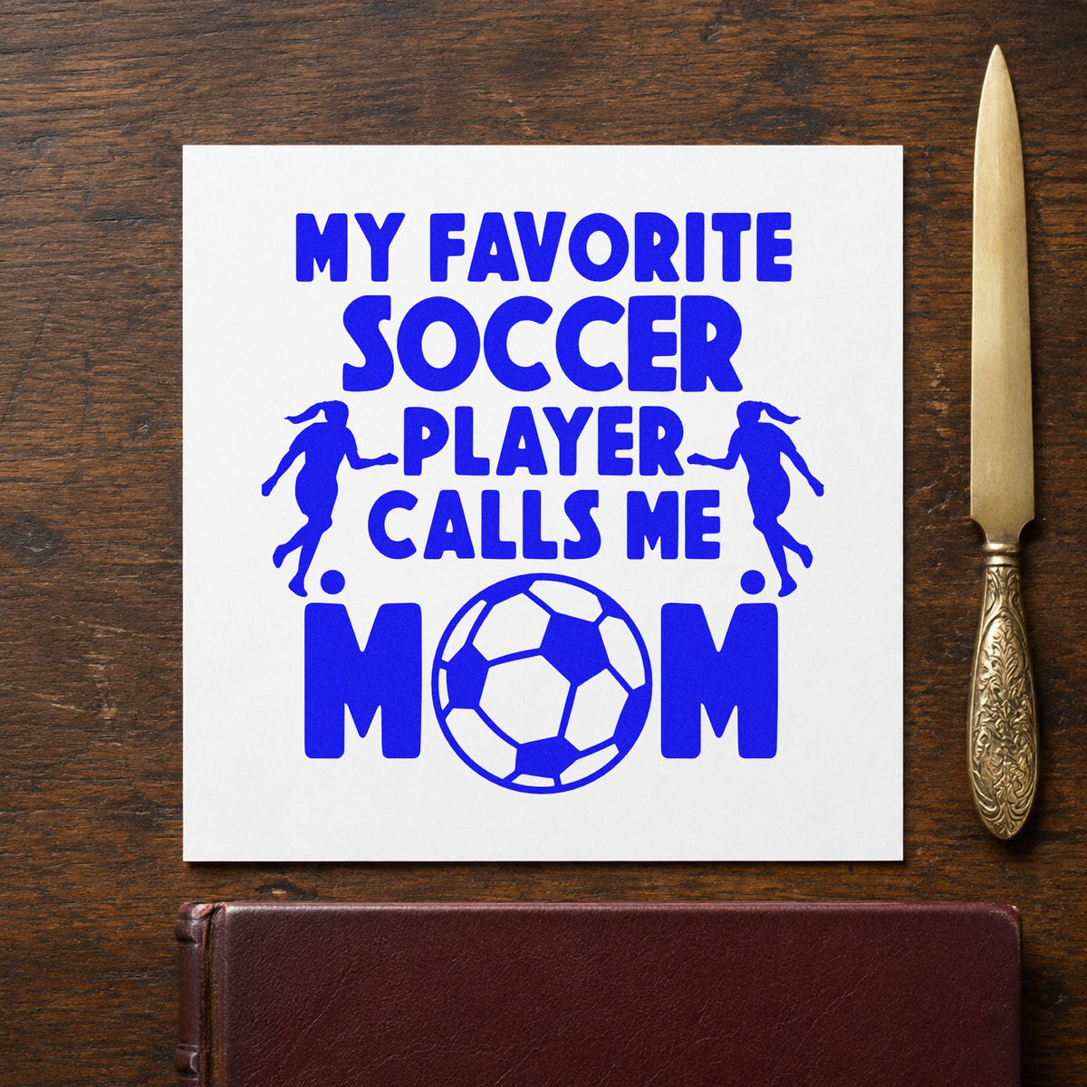 Favorite Soccer Player Mom craft stamp in blue ink on cardstock, an easy option for bleacher cushion backs.