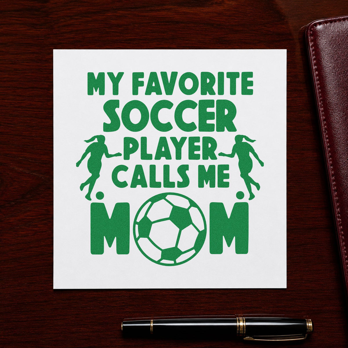 Favorite Soccer Player Mom craft stamp imprint in green ink on a handmade project, one idea being framed stair gallery.