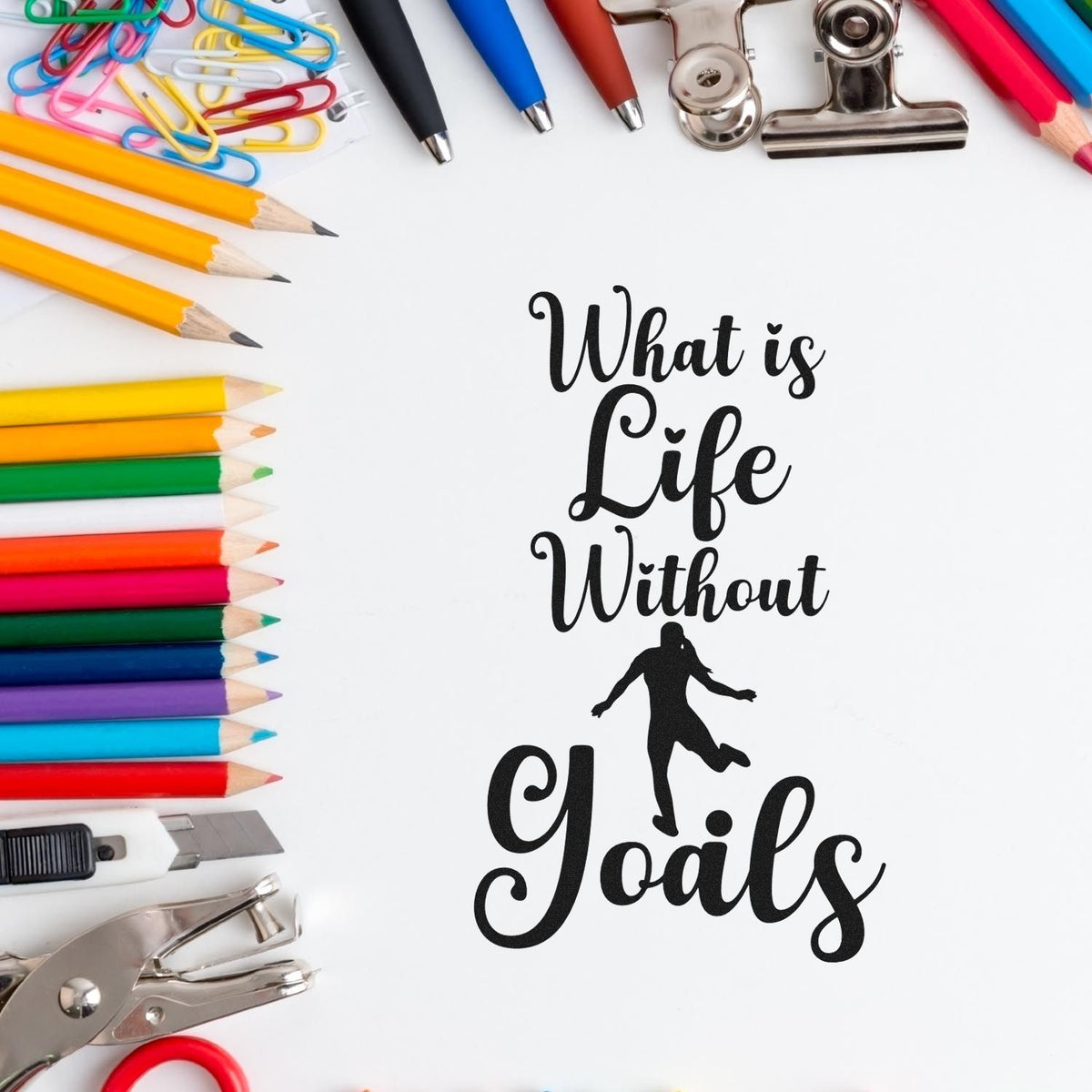 Colorful stationery with stamp and seal products, pencils, clips, pens and black What is Life Without Goals quote.