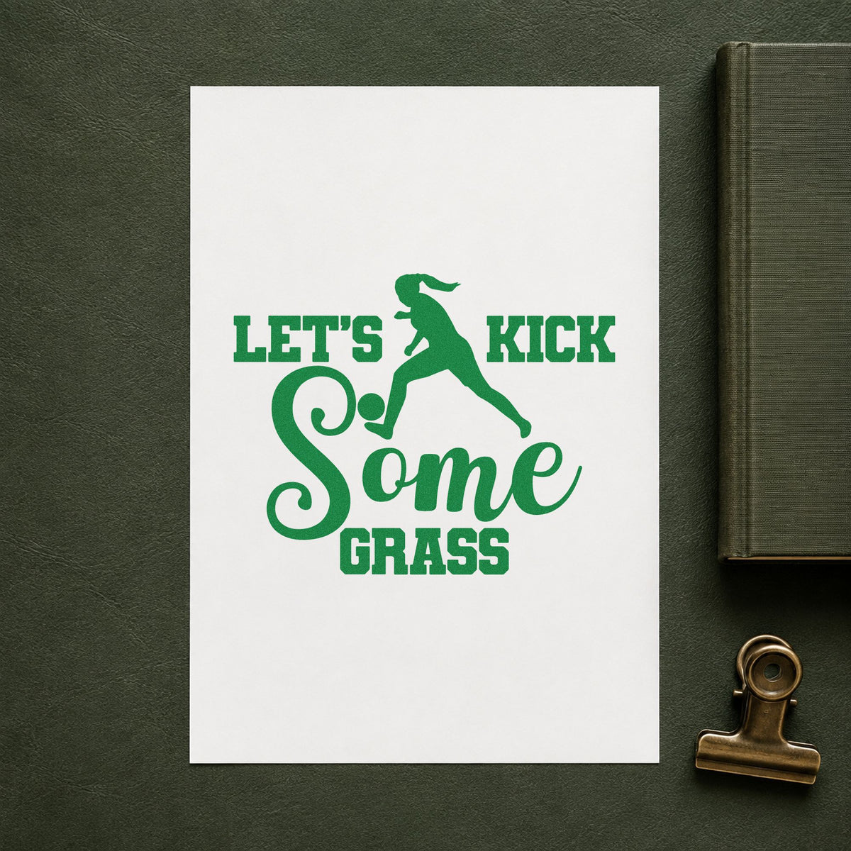 Let's Kick Some Grass craft stamp imprint in green ink on a handmade project, one idea being lineup sheet pages.
