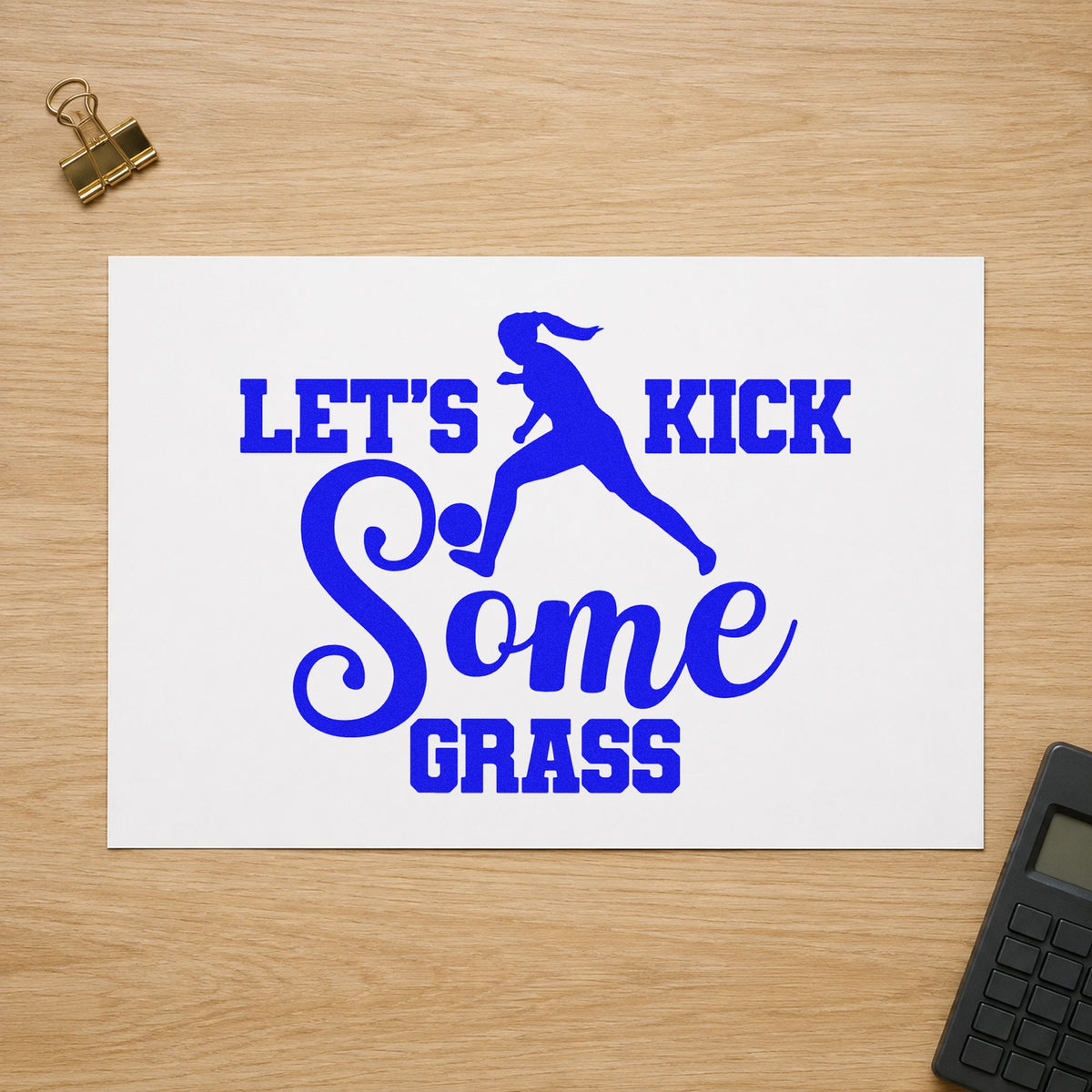 Let's Kick Some Grass craft stamp in blue ink on cardstock, an easy option for sock cuff transfers.