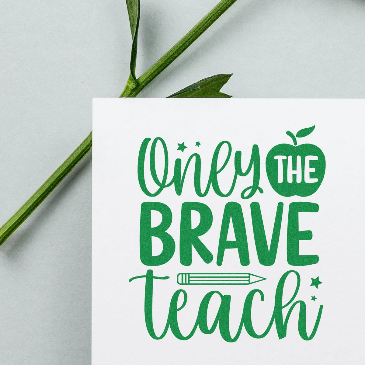 Green Only the Brave Teach stamp and seal design on white card, with pencil icon, apple, and star accents.