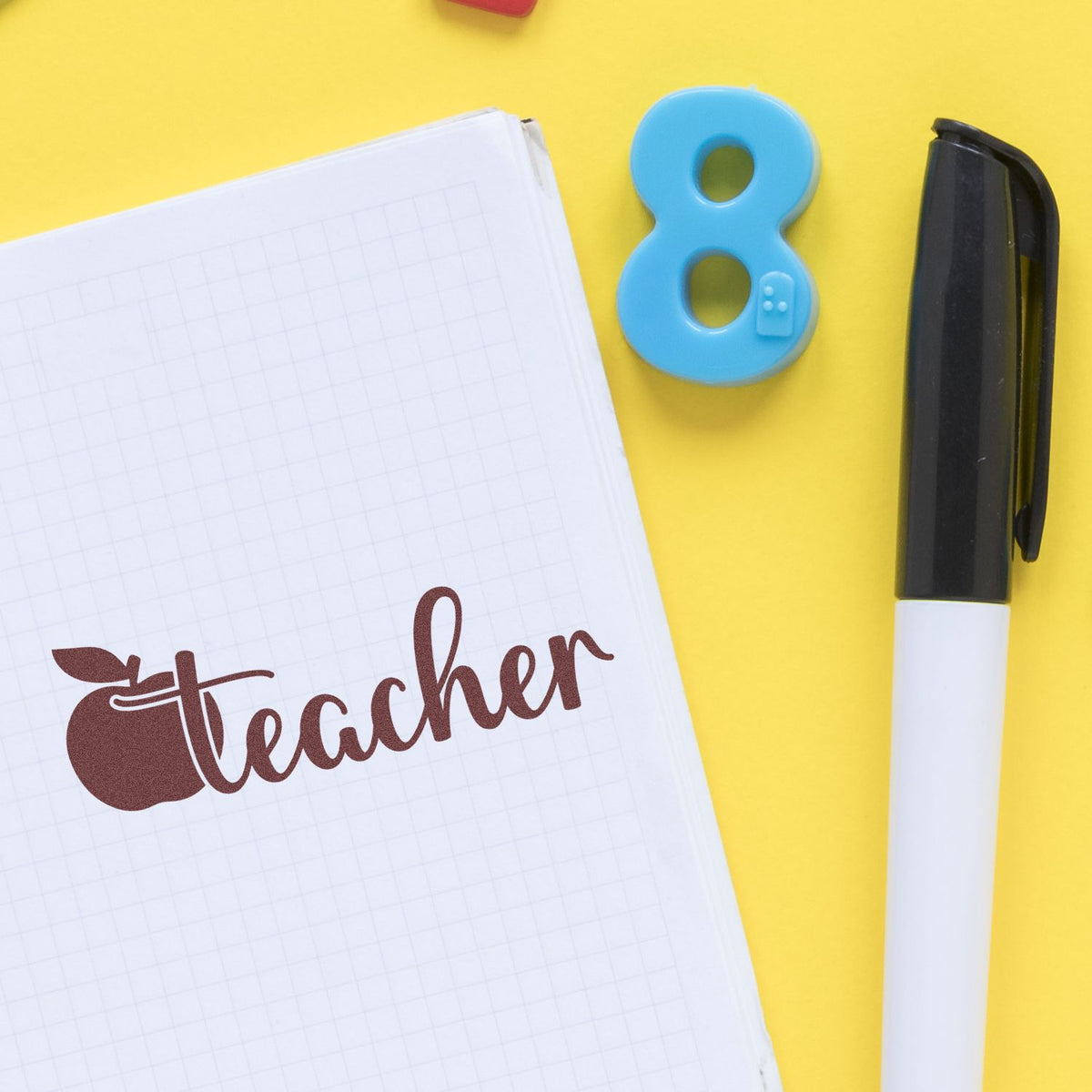 Teach Love Inspire rubber stamp shown in brown ink, stamped for projects such as mentorship gift tags.