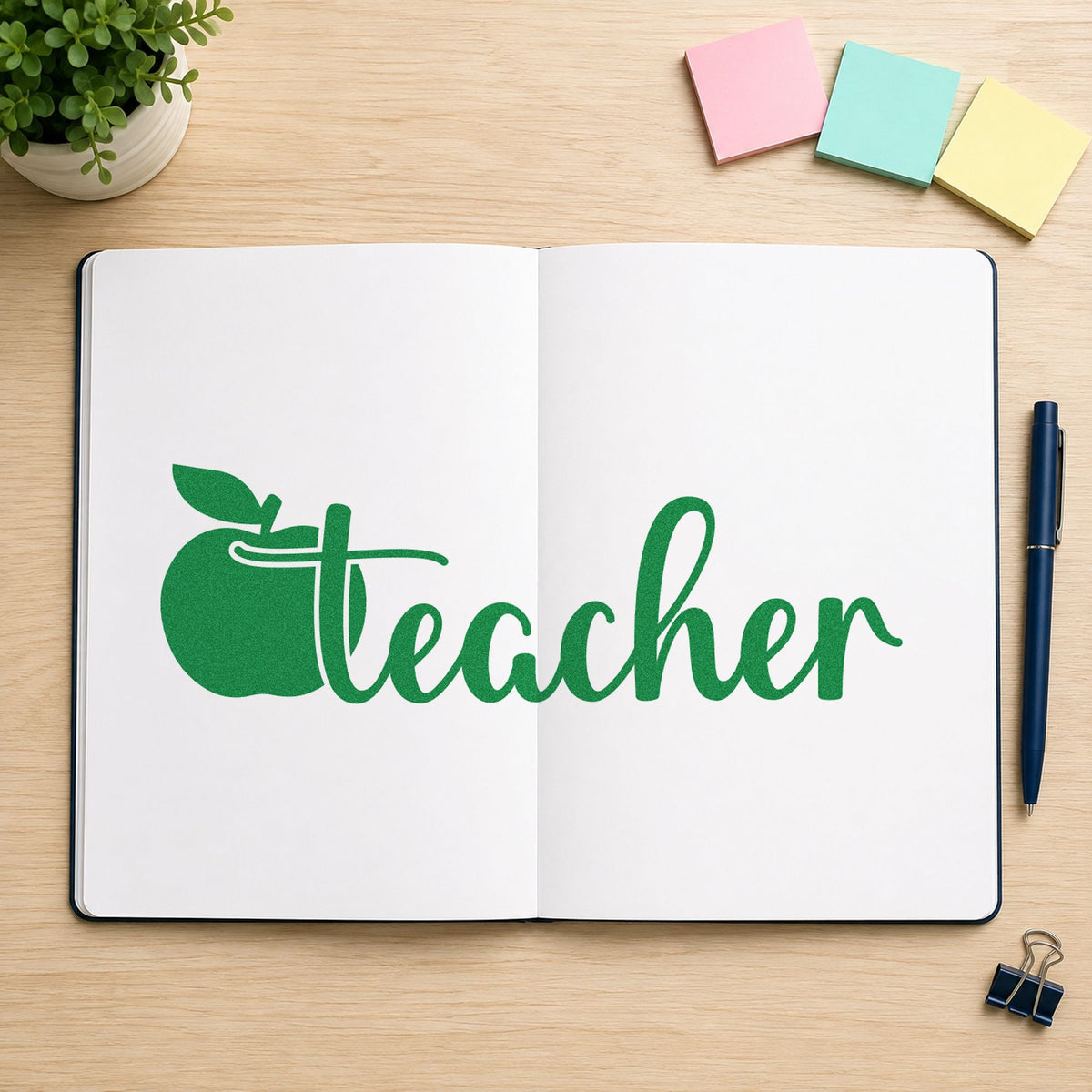 Teacher Apple Script craft stamp imprint in green ink on a handmade project, one idea being binder spine pages.