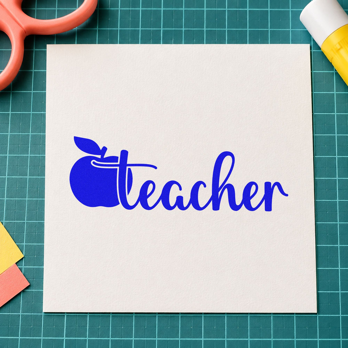 Teacher Apple Script craft stamp in blue ink on cardstock, an easy option for mug wrap panels.