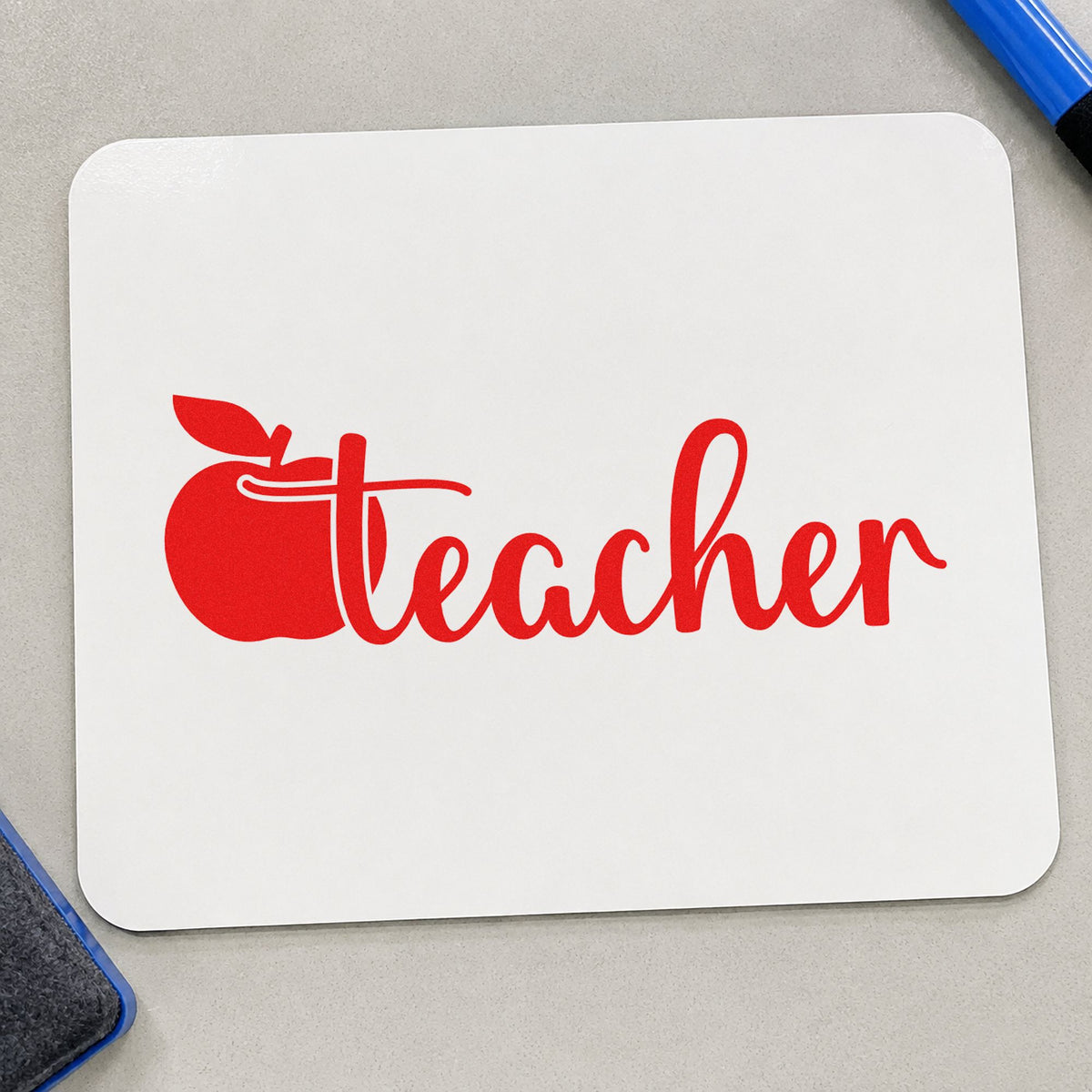 Teacher Apple Script rubber stamp shown in red ink, stamped for projects such as sub folder notes.