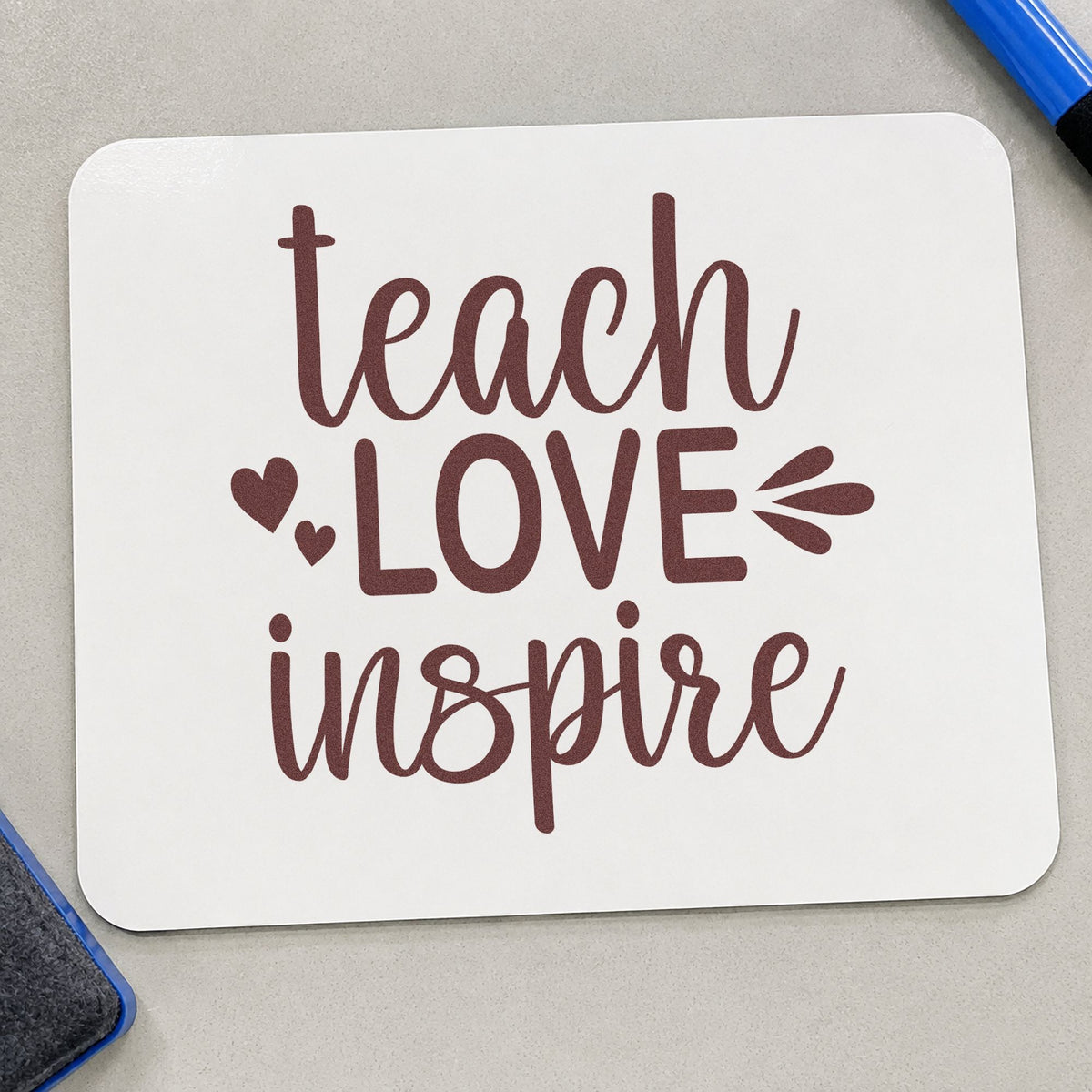 Teach Love Inspire Hearts rubber stamp printed in brown ink, ready for smock hook labels and similar paper crafts.
