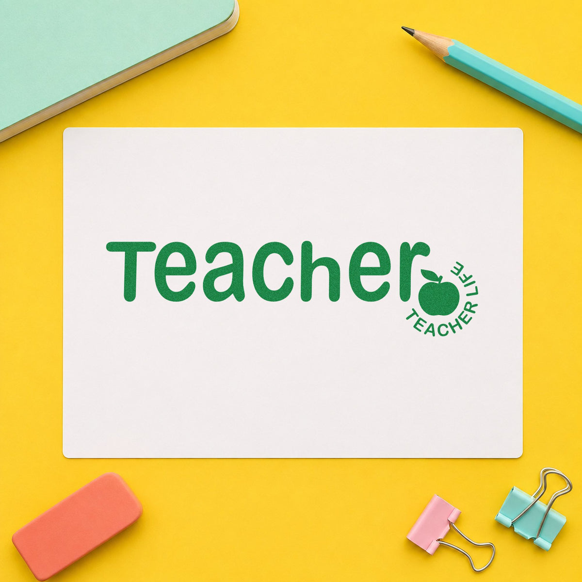 Teacher Life Apple craft stamp imprint in green ink on a handmade project, one idea being roll sheet pages.