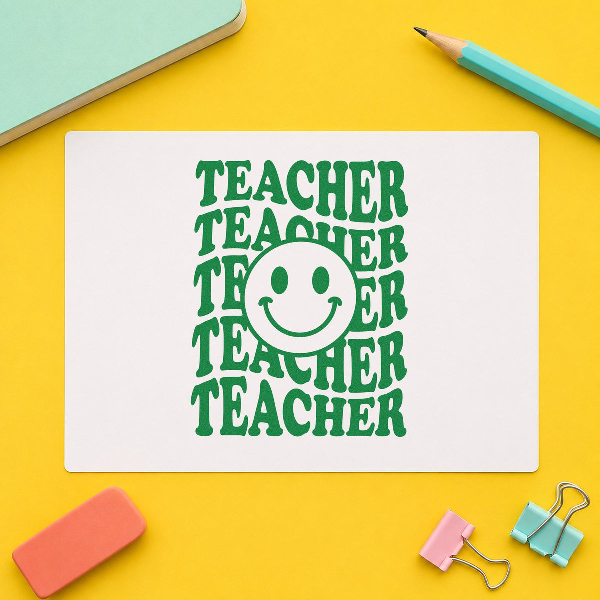 Teacher Smiley Stack craft stamp imprint in green ink on a handmade project, one idea being framed copy room.
