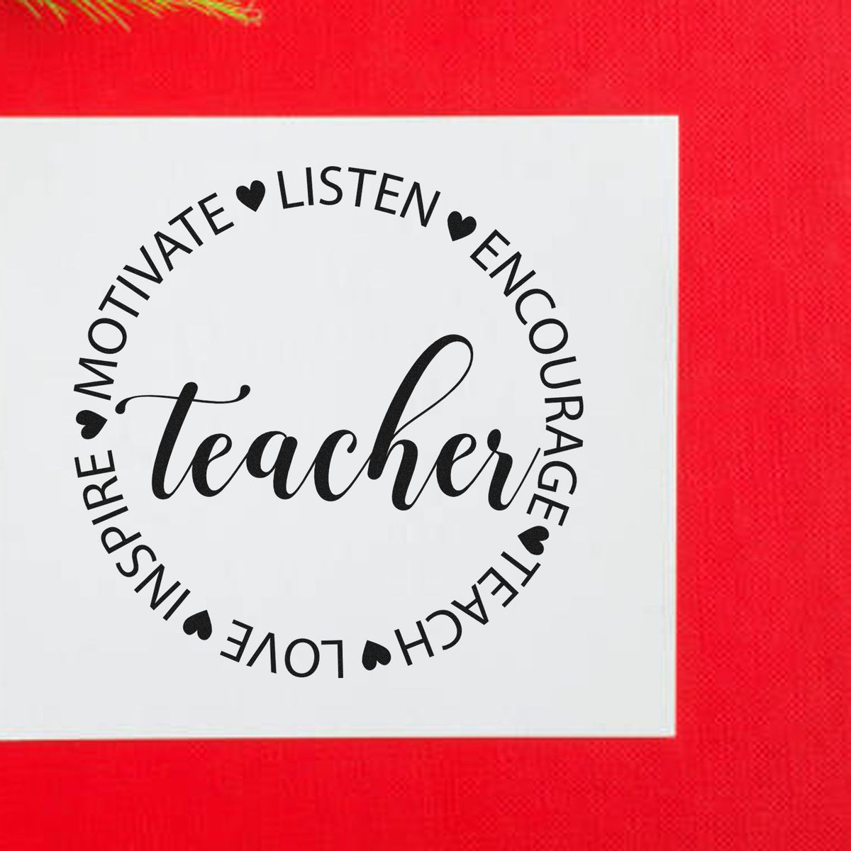 Circular black teacher stamp seal with hearts on a white square, set against a bright red background.