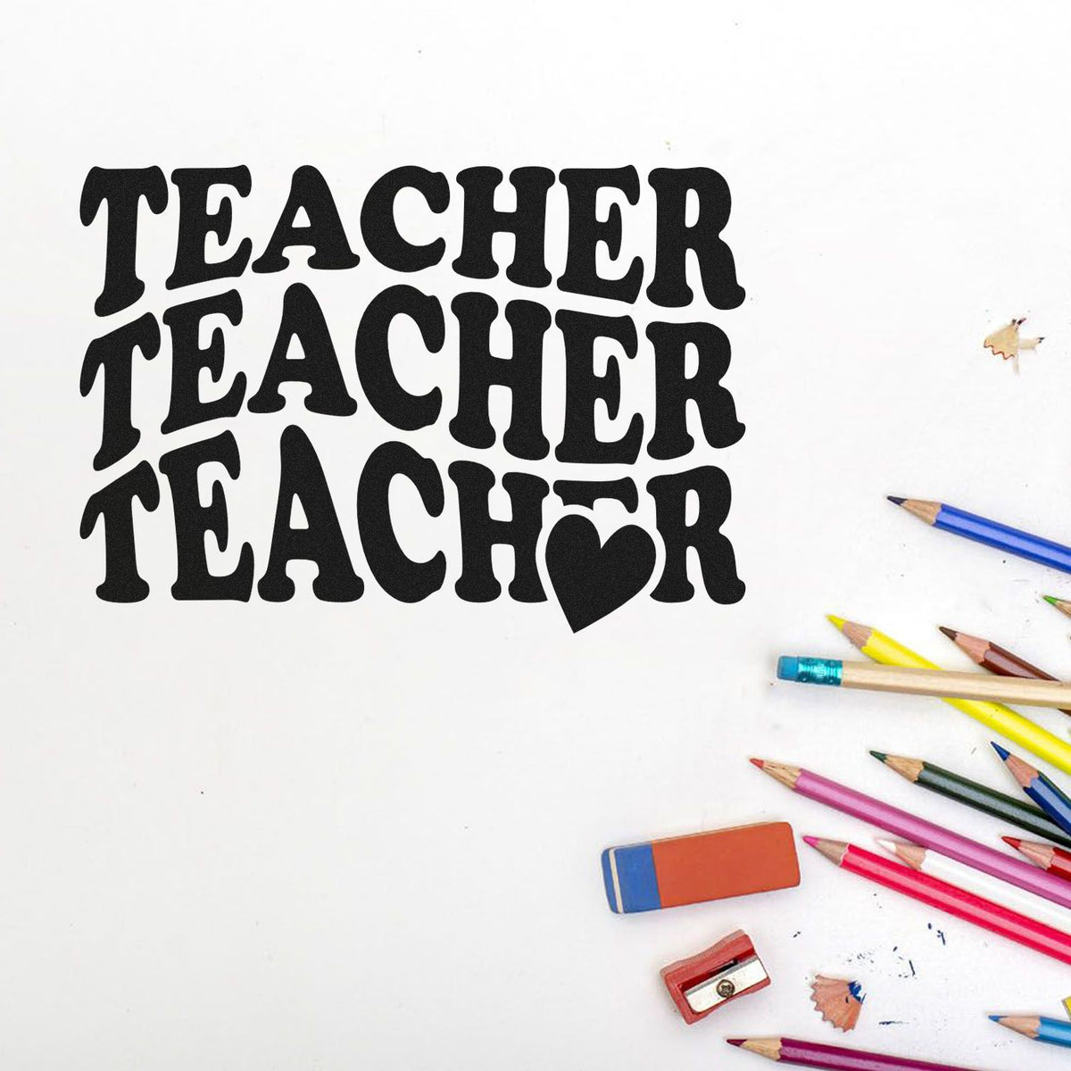 Black TEACHER stamp with heart seal, surrounded by colorful pencils, eraser, and sharpener on a white background.