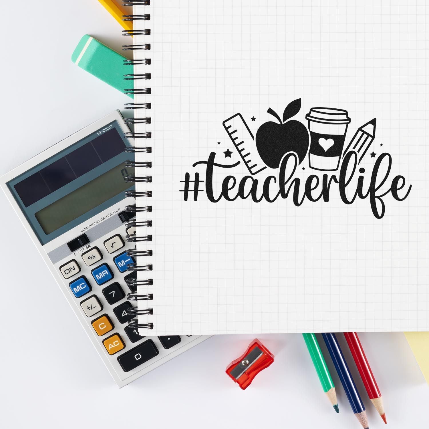 Black teacherlife stamp and seal design on grid notebook with apple, ruler, coffee cup, calculator, pencils, and sharpener