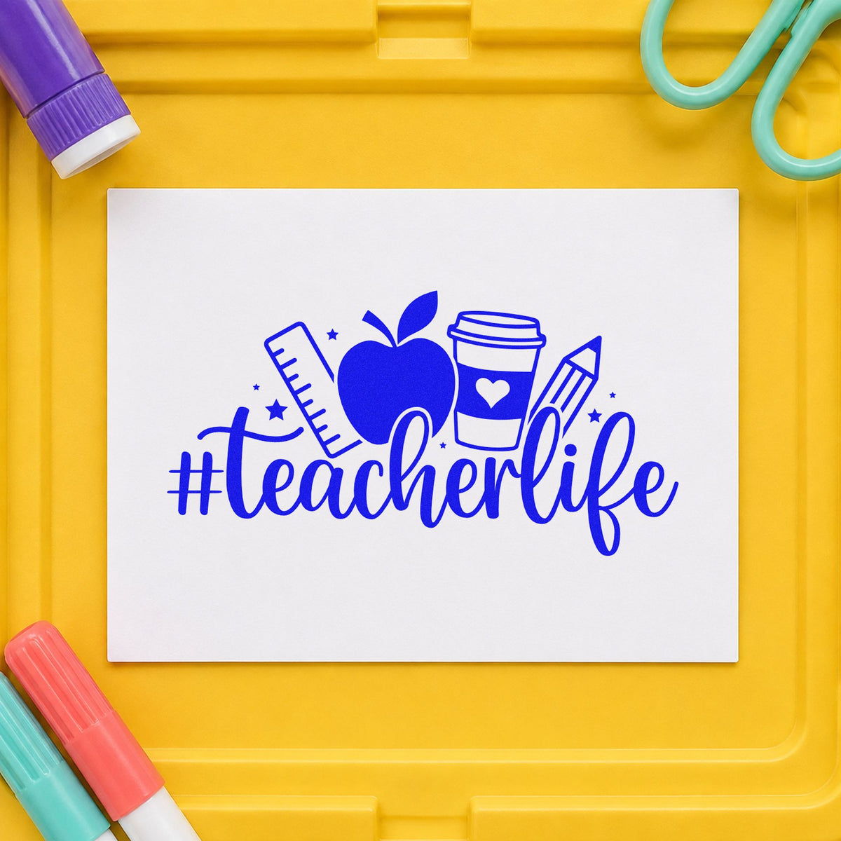 Hashtag Teacher Life craft stamp imprinted in blue ink on paper, a design suited to staff party invitations.