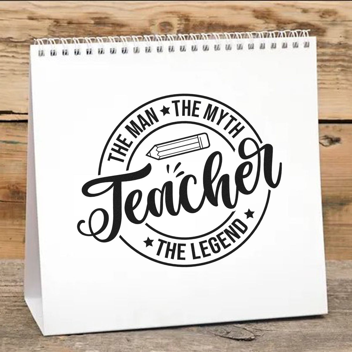 White stamp-and-seal gift bag with black teacher logo, pencil icon, and The Man, The Myth, Teacher, The Legend text.