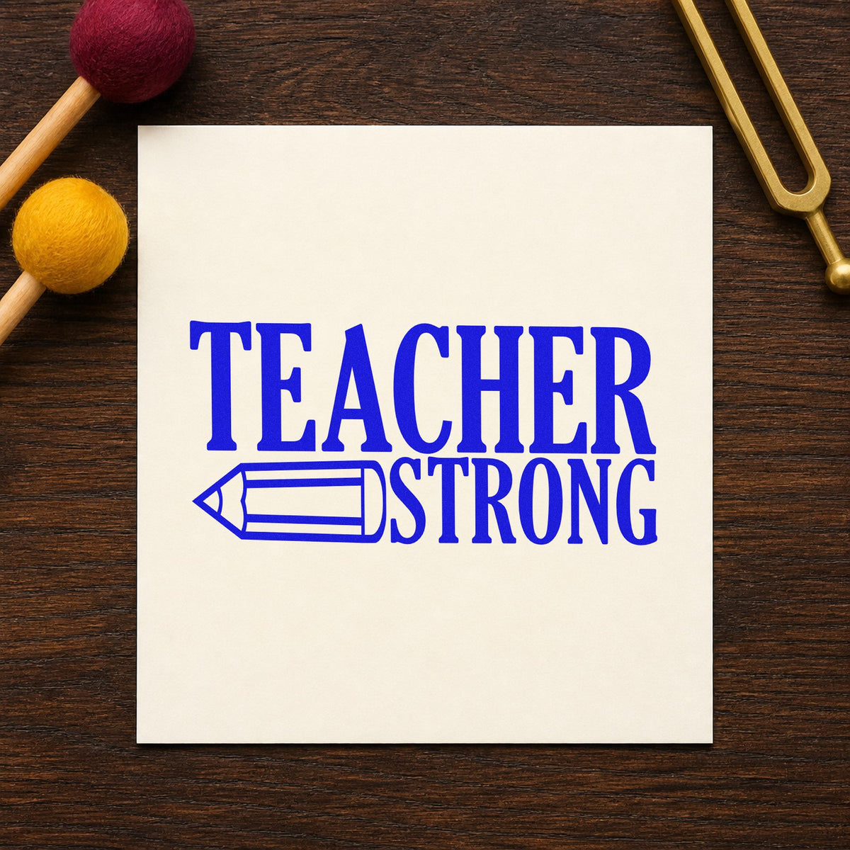 Teacher Strong Pencil craft stamp imprinted in blue ink on paper, a design suited to water jug labels.