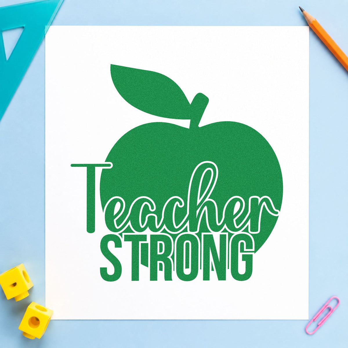 Teacher Strong Apple craft stamp imprint in green ink on a handmade project, one idea being cider label pages.