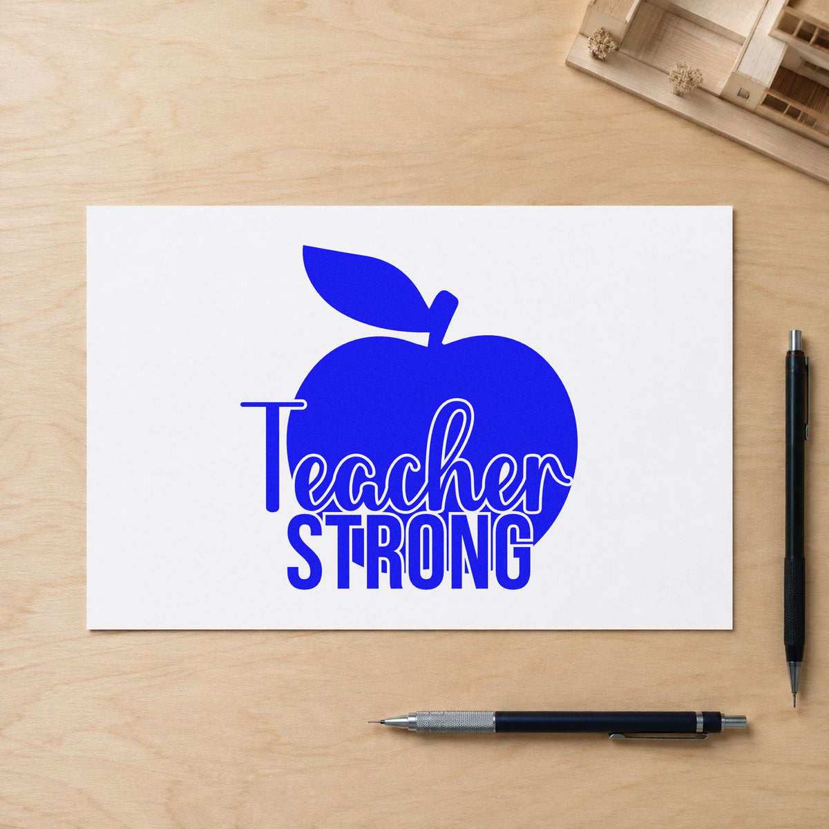 Teacher Strong Apple craft stamp in blue ink on cardstock, an easy option for canvas banner panels.