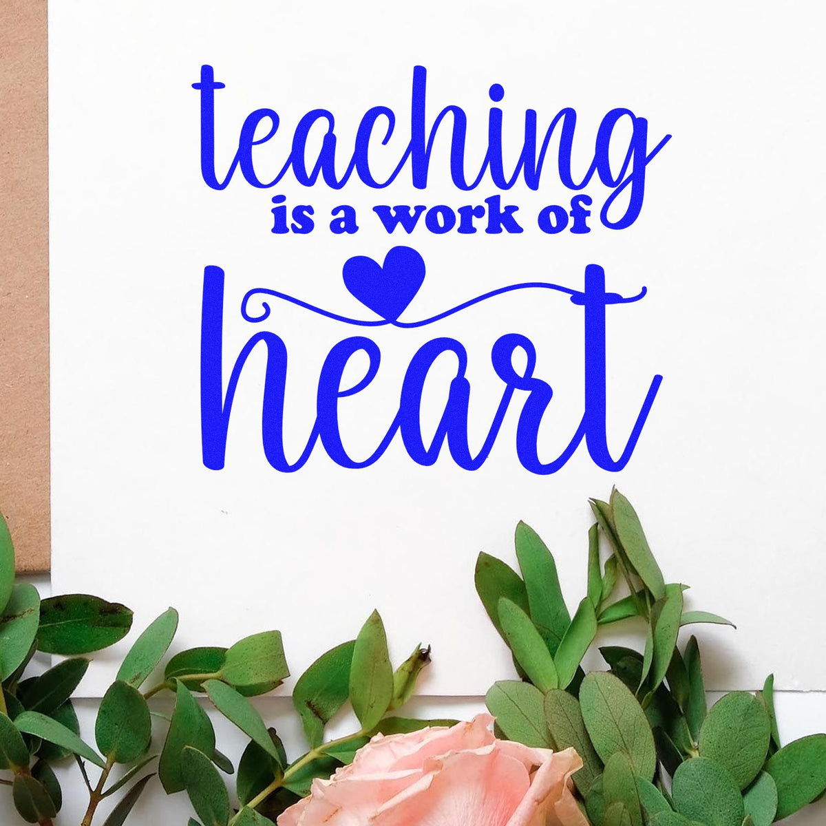 Blue teaching is a work of heart stamp/seal design with heart, green leaves, and pink rose