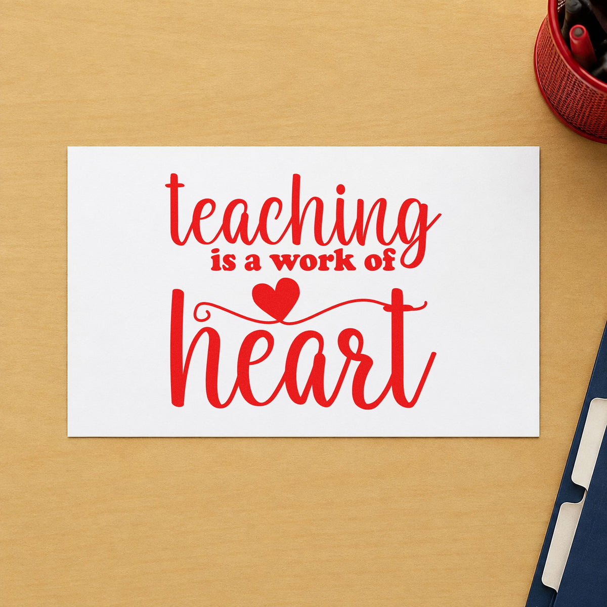 Teaching Is a Work of Heart rubber stamp shown in red ink, stamped for projects such as service award notes.