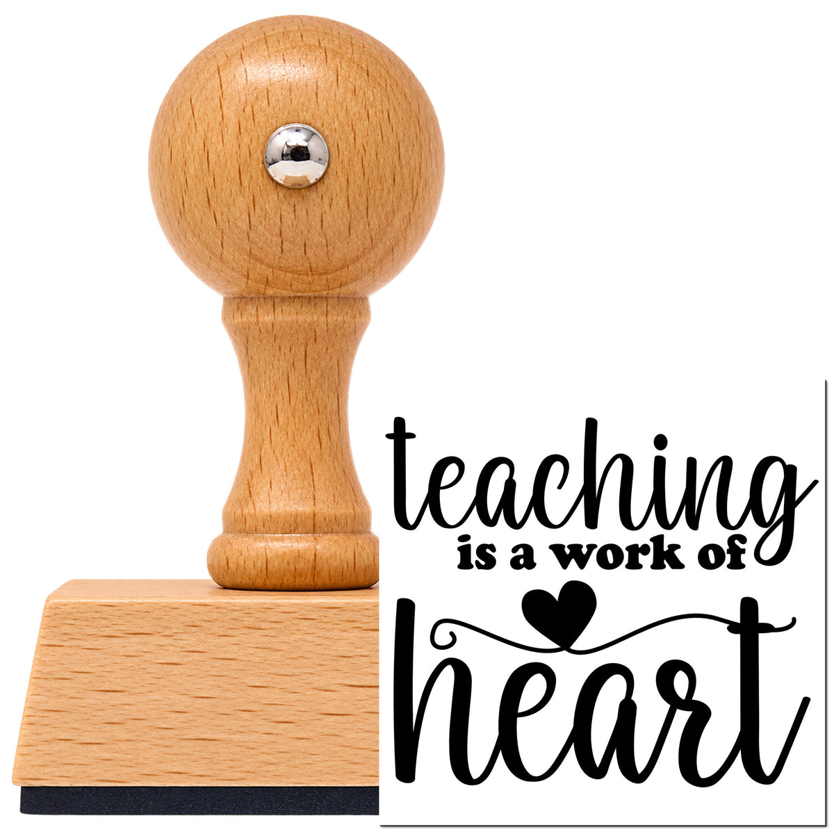 Vintage Pro beech wood stamp with a round knob handle, shown with its black Teaching Is A Work Of Heart imprint on white.