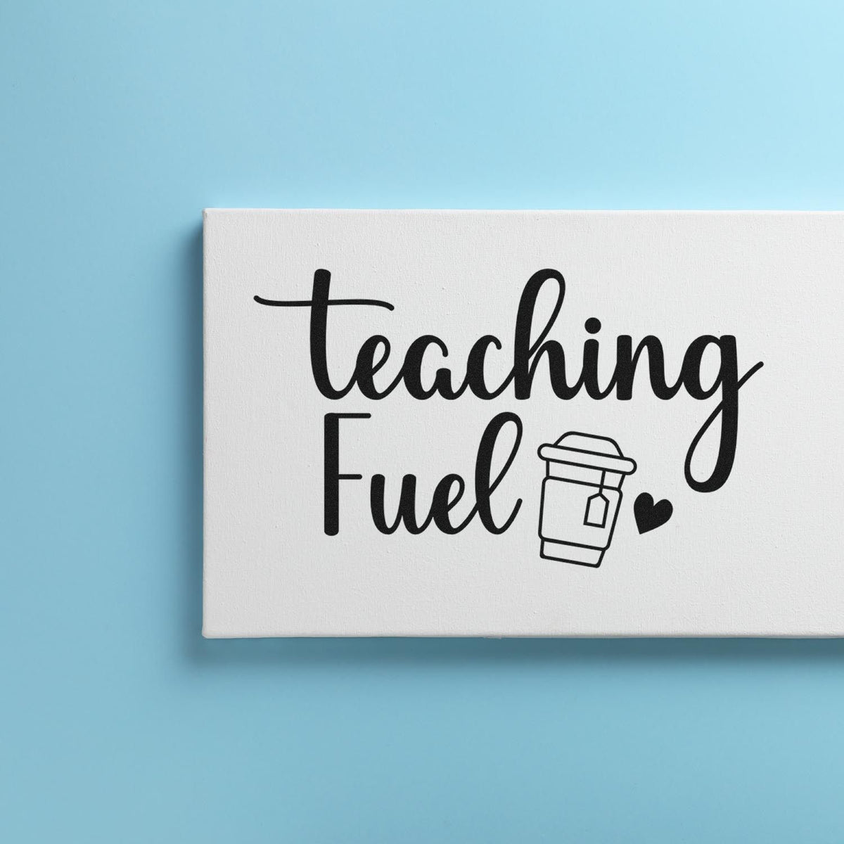 White teaching stamp seal with black script lettering, coffee cup icon and heart on light blue background.
