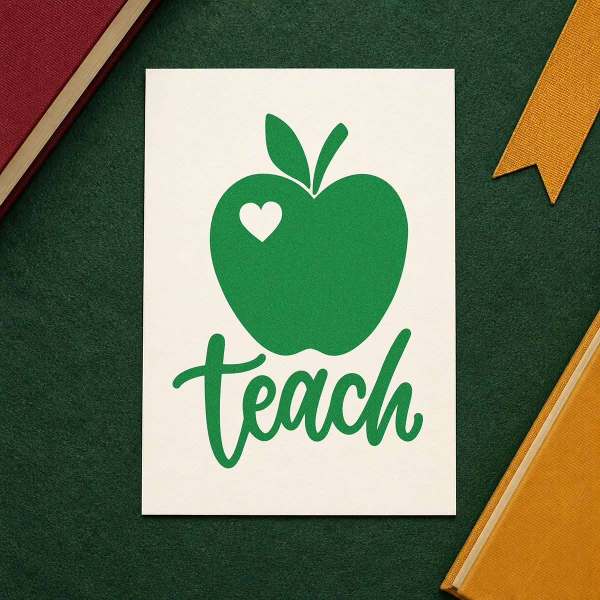 Teach Apple Heart craft stamp imprint in green ink on a handmade project, one idea being minimal journal pages.