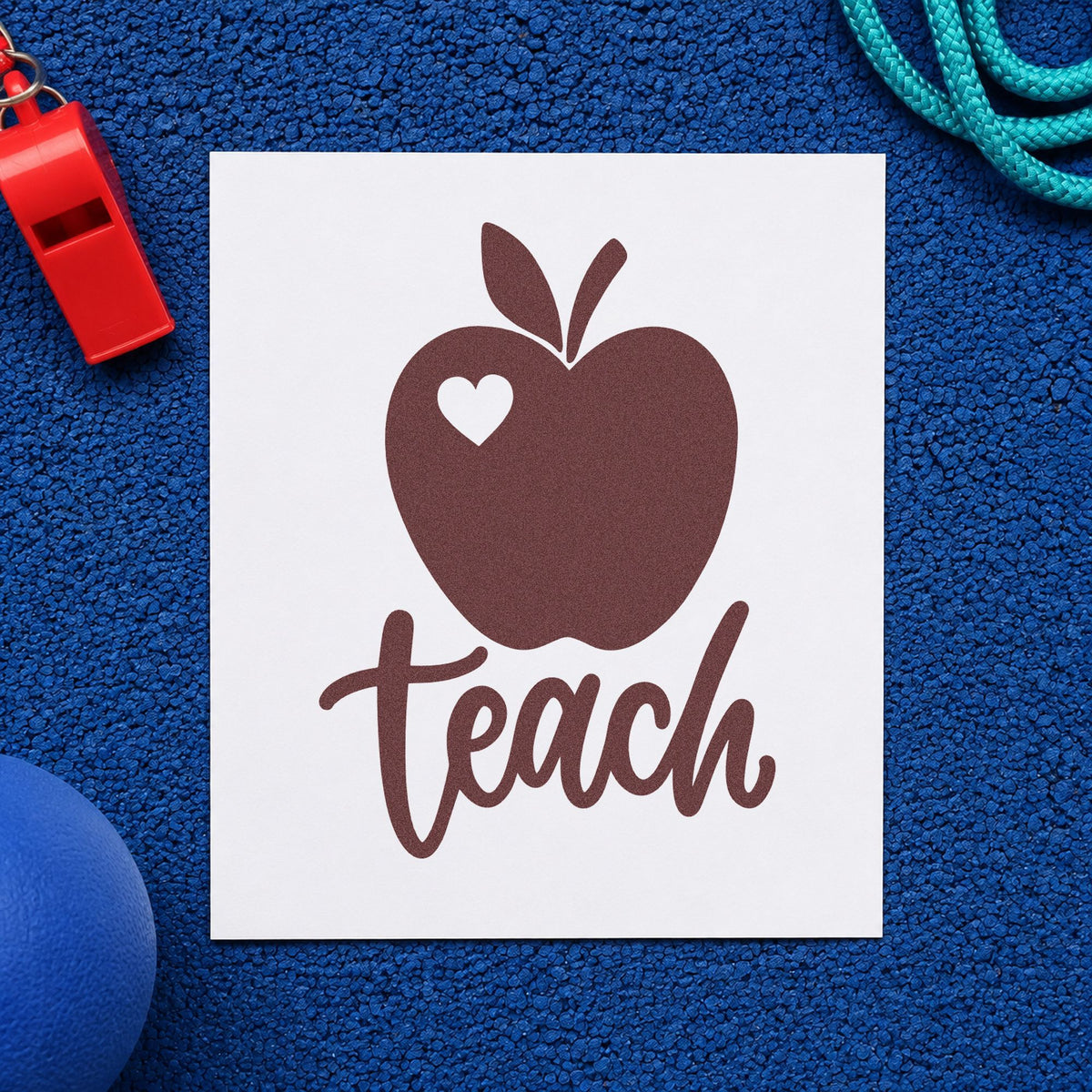 Teach Apple Heart rubber stamp printed in brown ink, ready for single stamp crafts and similar paper crafts.