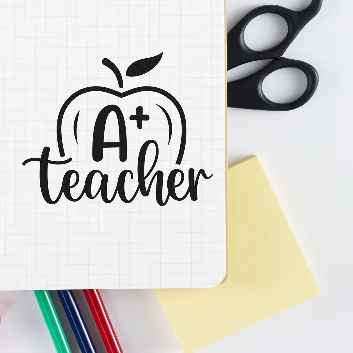 A Plus Teacher Apple Premium Wood-Mounted Stamp - Vintage Pro imprint stamped in black ink. An outlined apple holds an A+ above "Teacher" script.