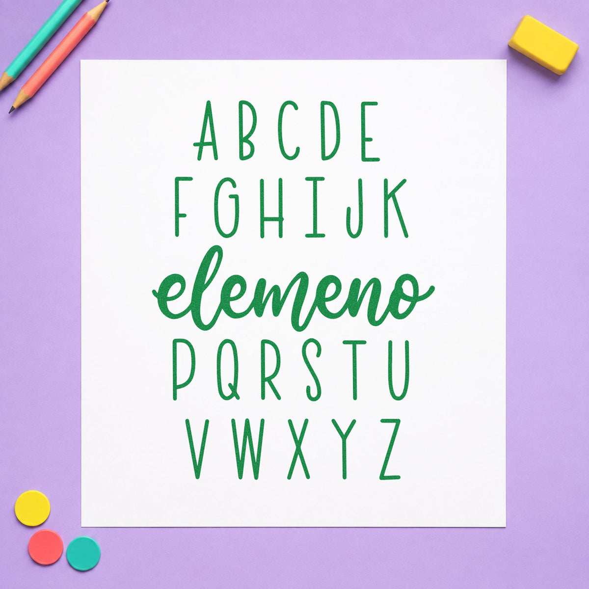 Alphabet Elemeno craft stamp imprint in green ink on a handmade project, one idea being name practice pages.