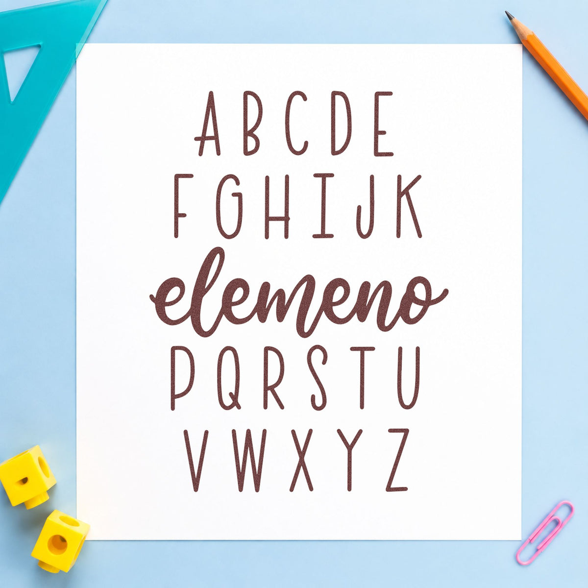 Alphabet Elemeno rubber stamp printed in brown ink, ready for magnet tile crafts and similar paper crafts.