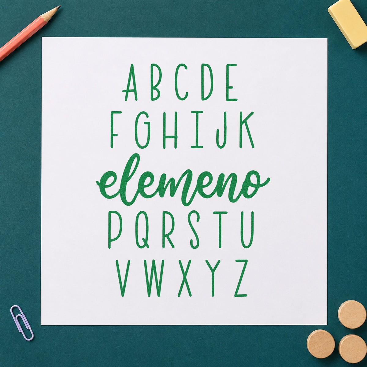 Alphabet Elemeno craft stamp imprint in green ink on a handmade project, one idea being framed alphabet rug.