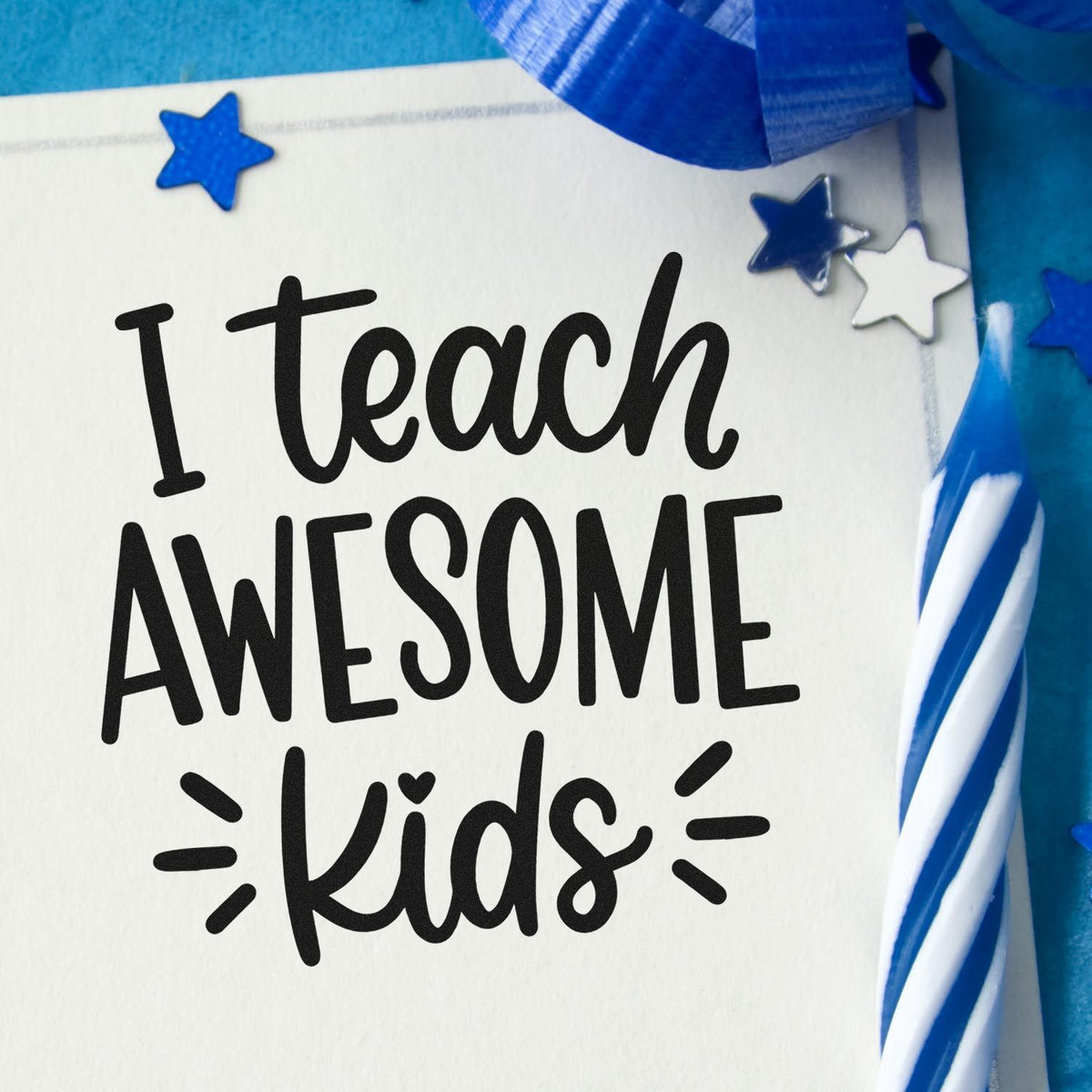 Black I Teach Awesome Kids stamp with blue star seals, white stars, and ribbon on a white card