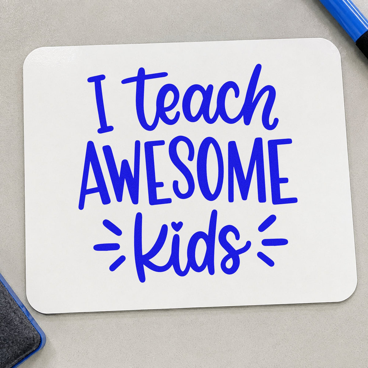 I Teach Awesome Kids craft stamp in blue ink on cardstock, an easy option for weighted lap panels.