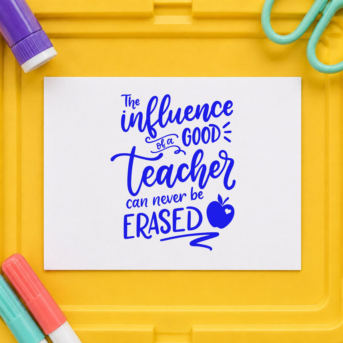 Good Teacher Never Erased craft stamp imprinted in blue ink on paper, a design suited to forwarding labels.