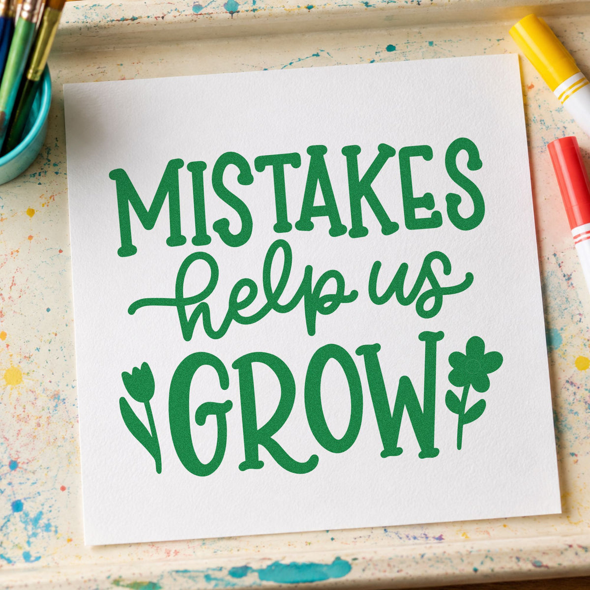 Mistakes Help Us Grow craft stamp imprint in green ink on a handmade project, one idea being error log pages.