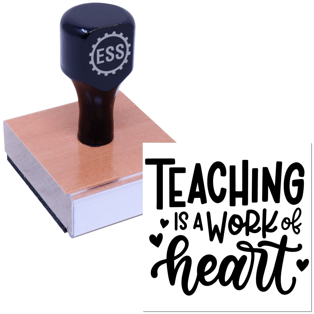 Navy ESS rubber stamp seal on a wooden base beside a white card reading "Teaching is a work of heart"