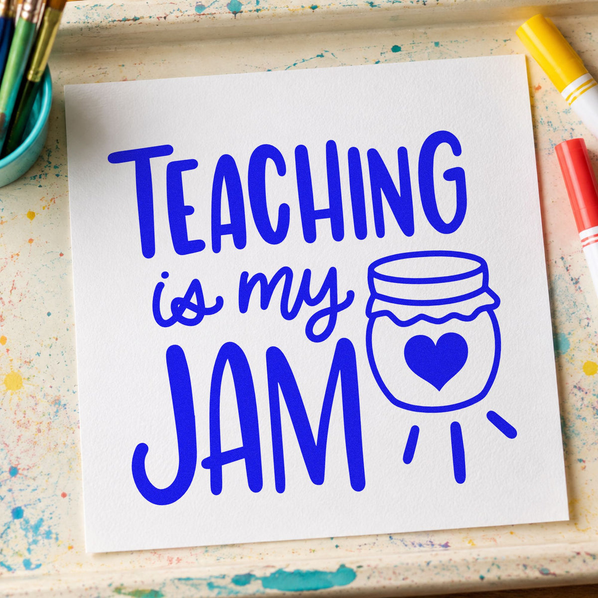 Teaching Is My Jam craft stamp in blue ink on cardstock, an easy option for kitchen towel panels.