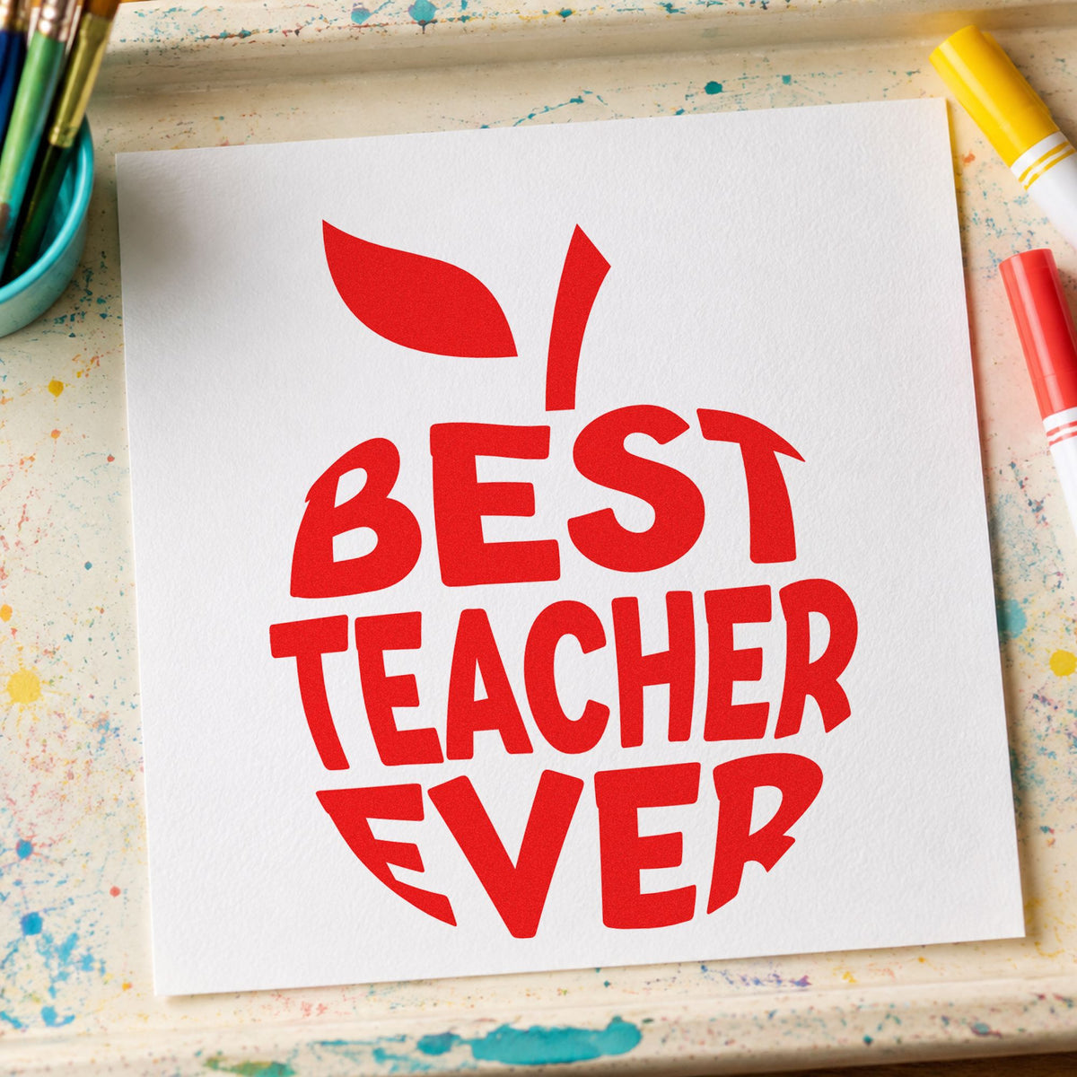 Best Teacher Ever Apple rubber stamp shown in red ink, stamped for projects such as nomination day notes.