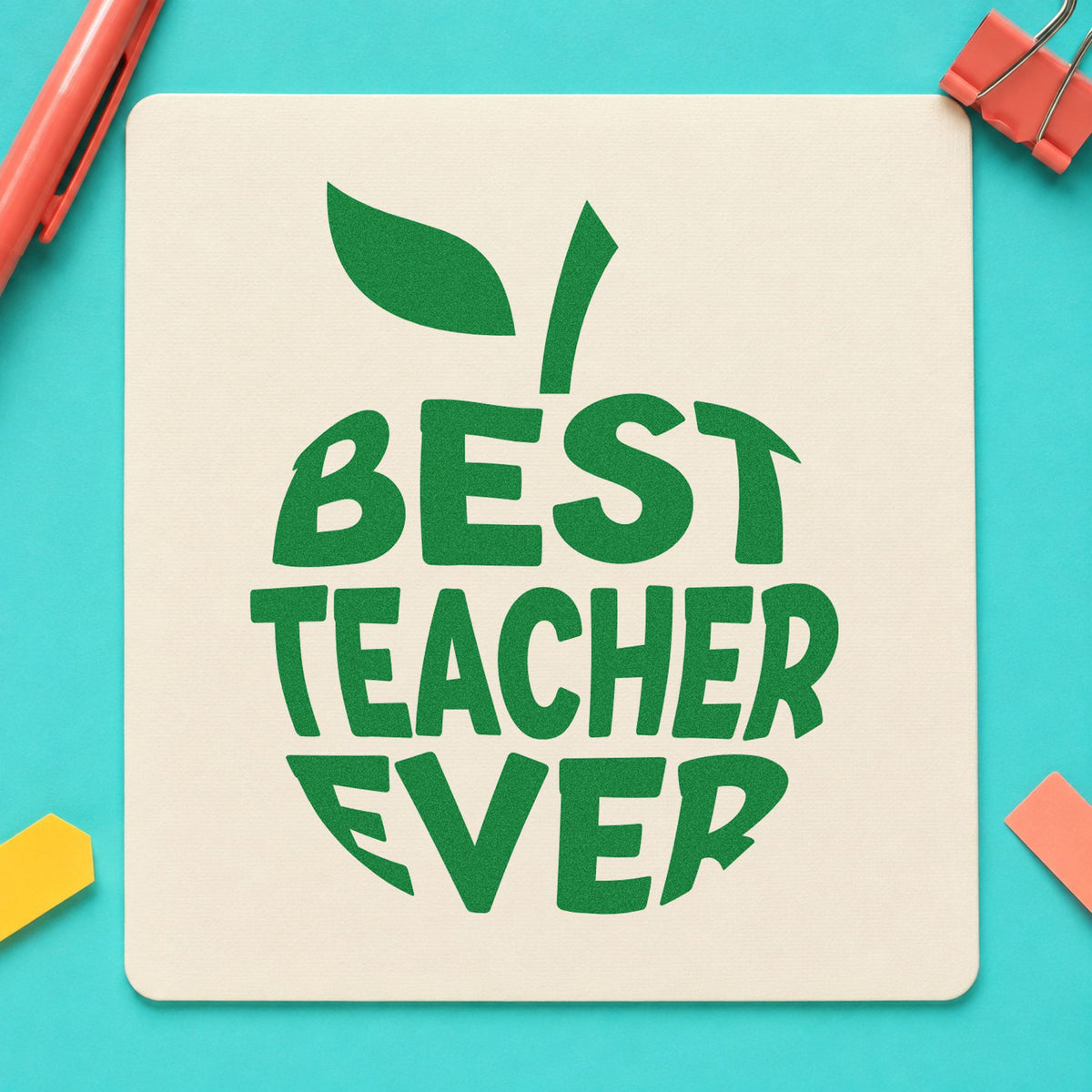 Best Teacher Ever Apple craft stamp imprint in green ink on a handmade project, one idea being framed cut paper.