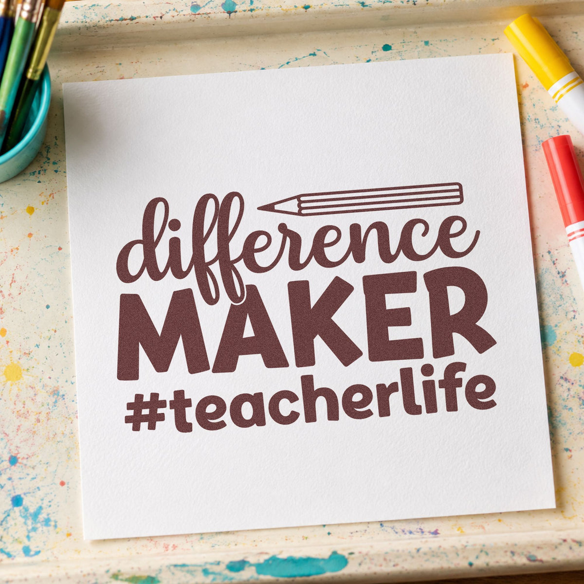 Difference Maker Teacher Life rubber stamp printed in brown ink, ready for pin button crafts and similar paper crafts.
