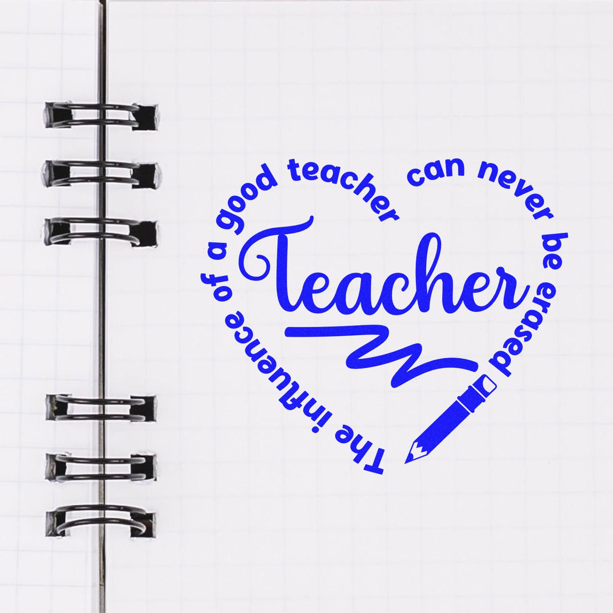Blue teacher endorsement stamp seal with pencil icon on white spiral notebook page, black binder rings.