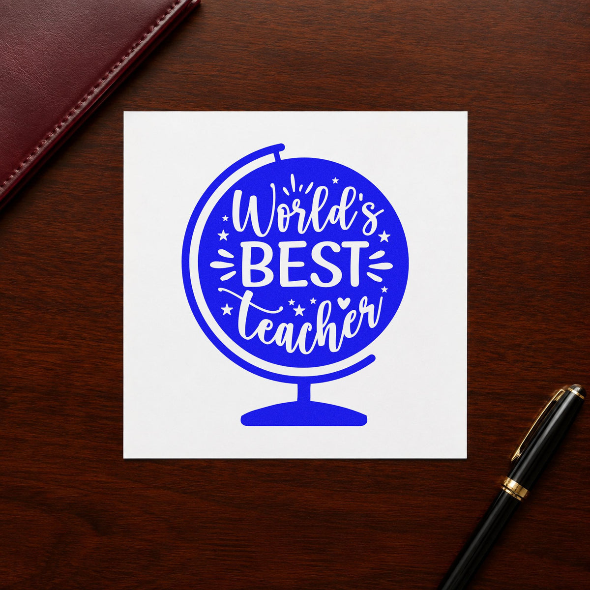 World's Best Teacher Globe craft stamp imprinted in blue ink on paper, a design suited to trophy shelf labels.
