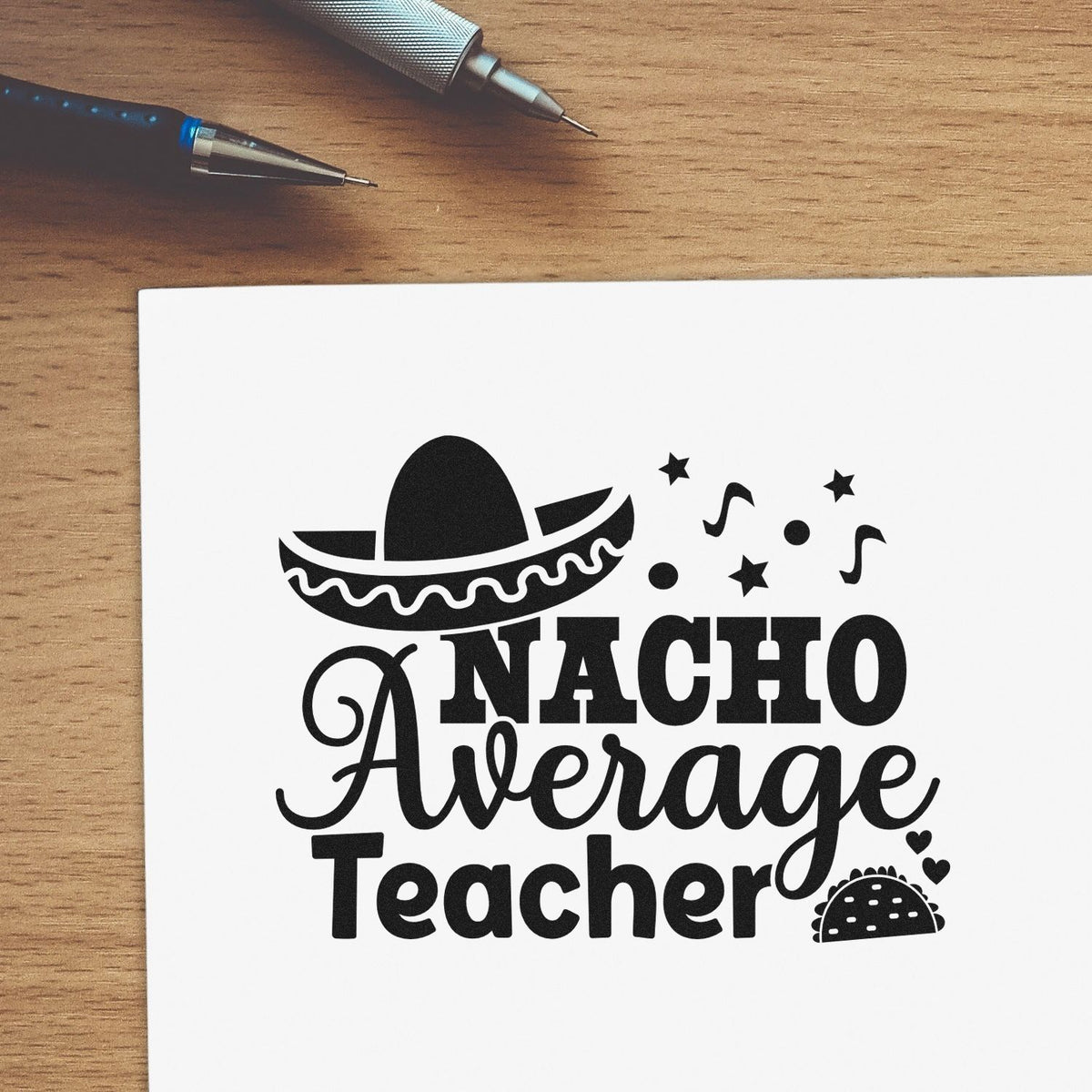 Black Nacho Average Teacher stamp/seal design with sombrero, taco, hearts, and stars on white paper