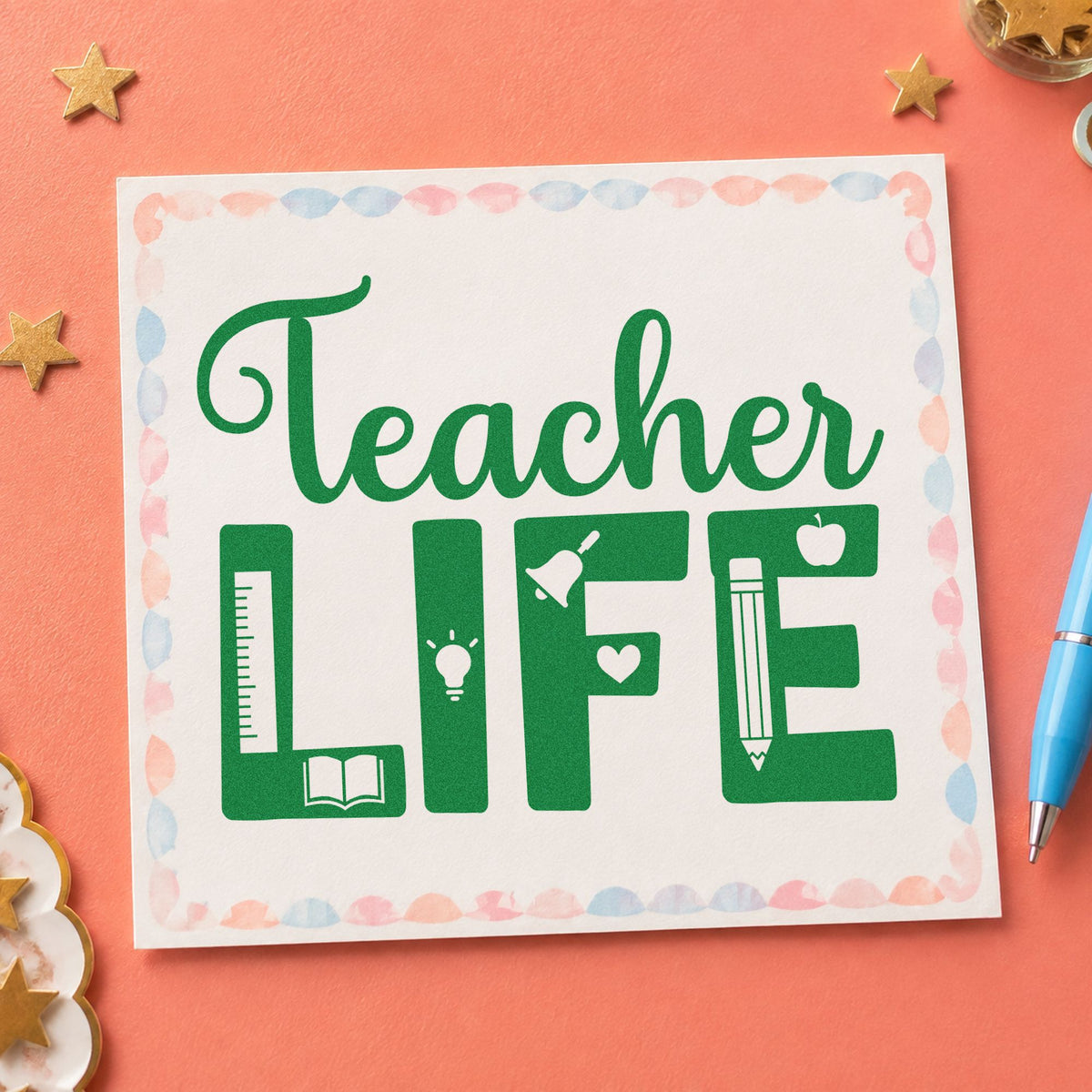 Teacher Life Supplies craft stamp imprint in green ink on a handmade project, one idea being planner insert pages.