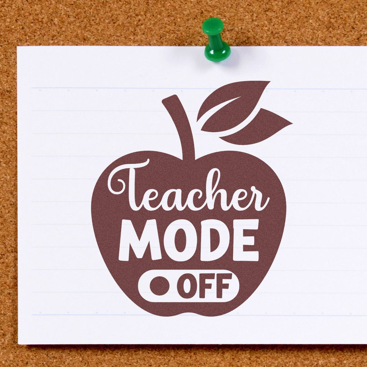 Brown apple-shaped Teacher Mode Off stamp and seal on white paper, pinned with a green pushpin on corkboard.