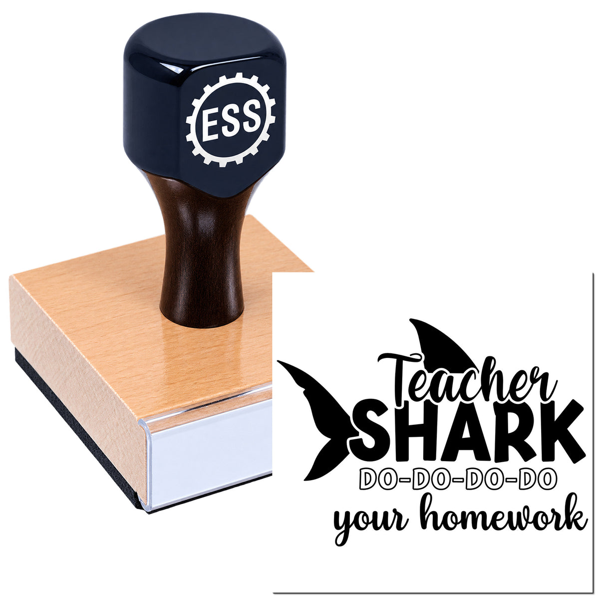 Black ESS rubber stamp seal on a wooden block, with Teacher Shark do-do-do-do your homework text.