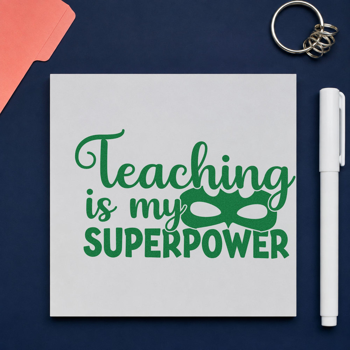 Teaching Is My Superpower Mask craft stamp imprint in green ink on a handmade project, one idea being framed drama wall.