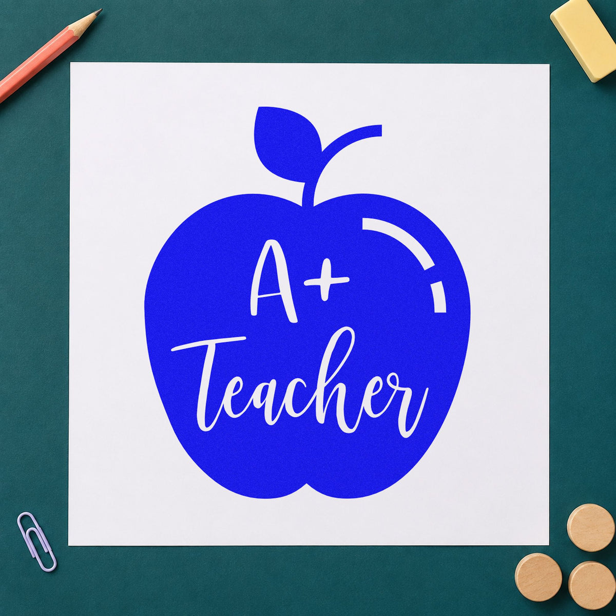 A Plus Teacher Solid Apple craft stamp in blue ink on cardstock, an easy option for dark tote panels.
